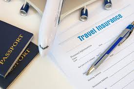 Travel insurance form with pen, airplane model, and passport on a desk, representing essential travel planning documents.